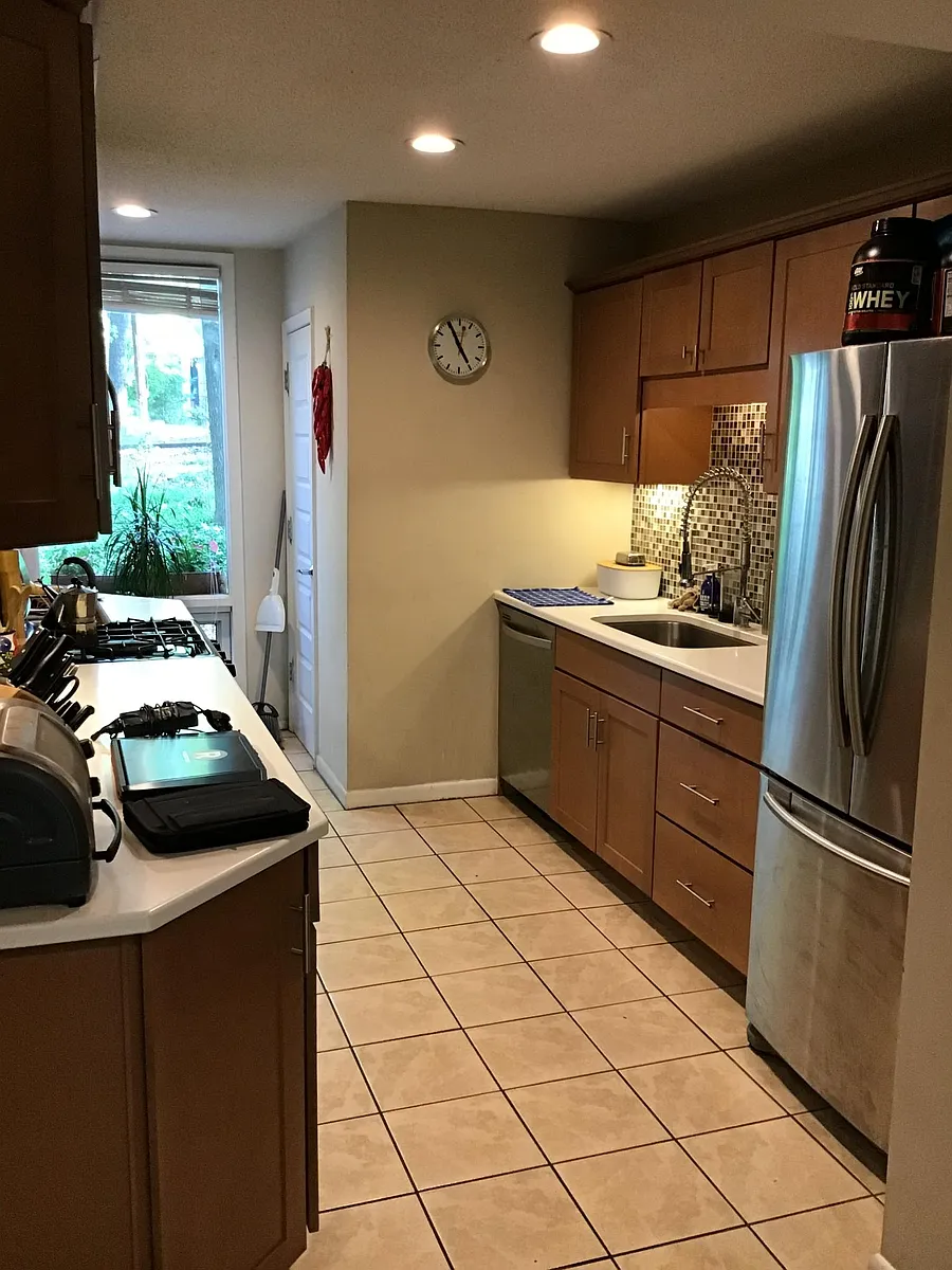 Chefs kitchen, high-end gas range, microwave, commercial style sink with granite counters, stainless steel appliances and dishwasher, ceramic tile floor. - 52 Davie Cir