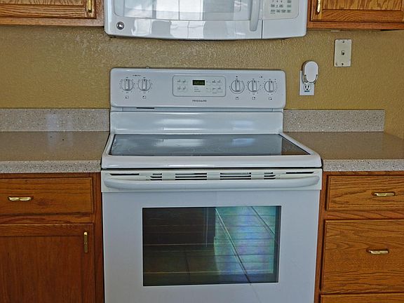 Stove with self-cleaning oven and microwave
