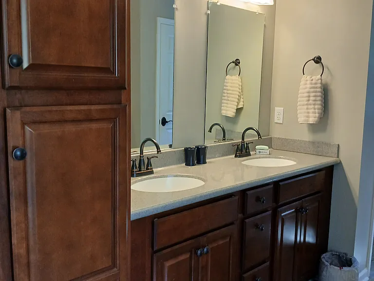 Linen closet and double sinks in master bath