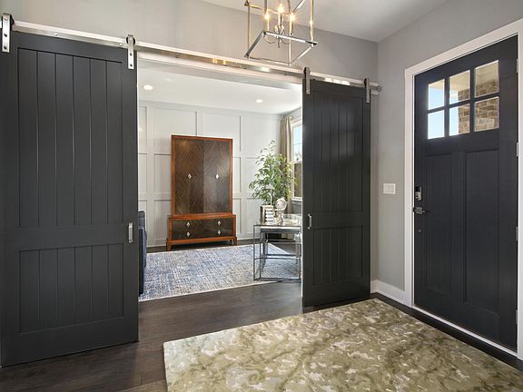 Foyer with barn doors to study