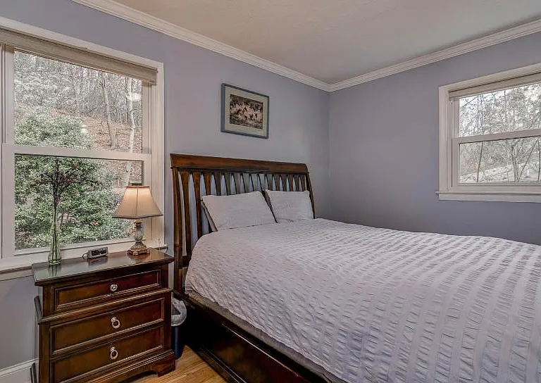 Elegant main bedroom with a queen sized bed