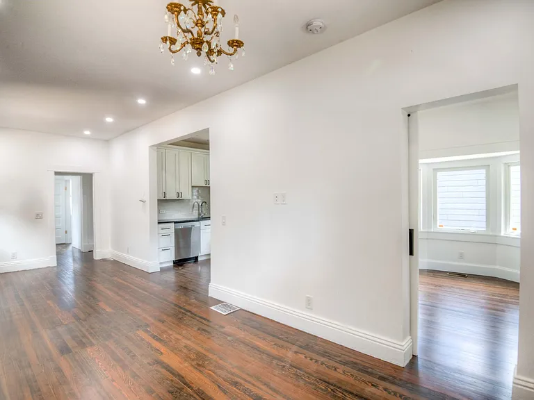 Entrance to front bedroom/office and kitchen off living room and dining room.