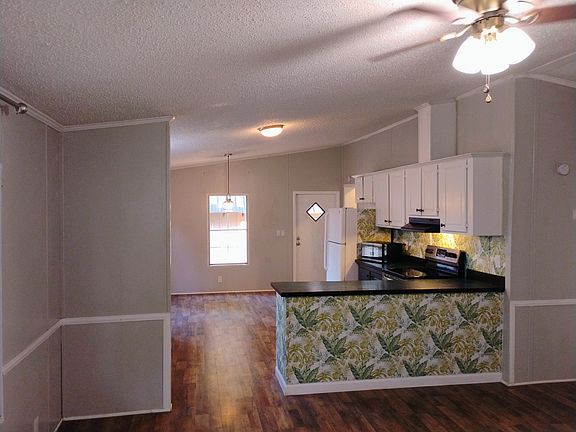 Living room facing the kitchen.