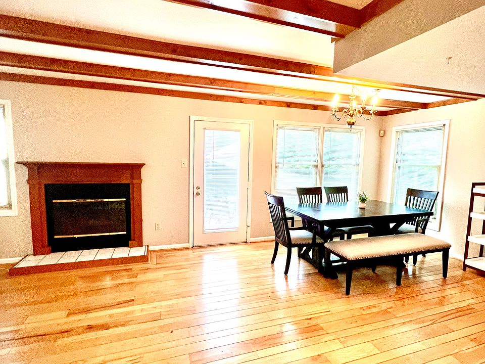 Open floor plan. Kitchen with fireplace and sitting area.