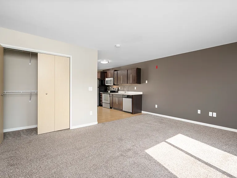 Bright, open-concept living area with modern kitchen and ample storage space, perfect for comfortable living. Bright, open-concept living area with modern kitchen and ample storage space, perfect for comfortable living.