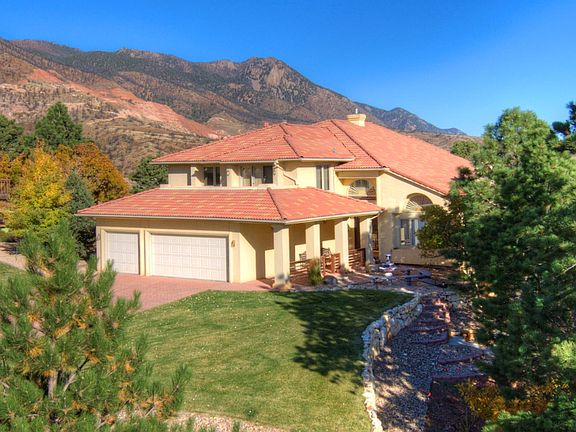 Beautiful tile roof and stucco, metal clad Pella Windows