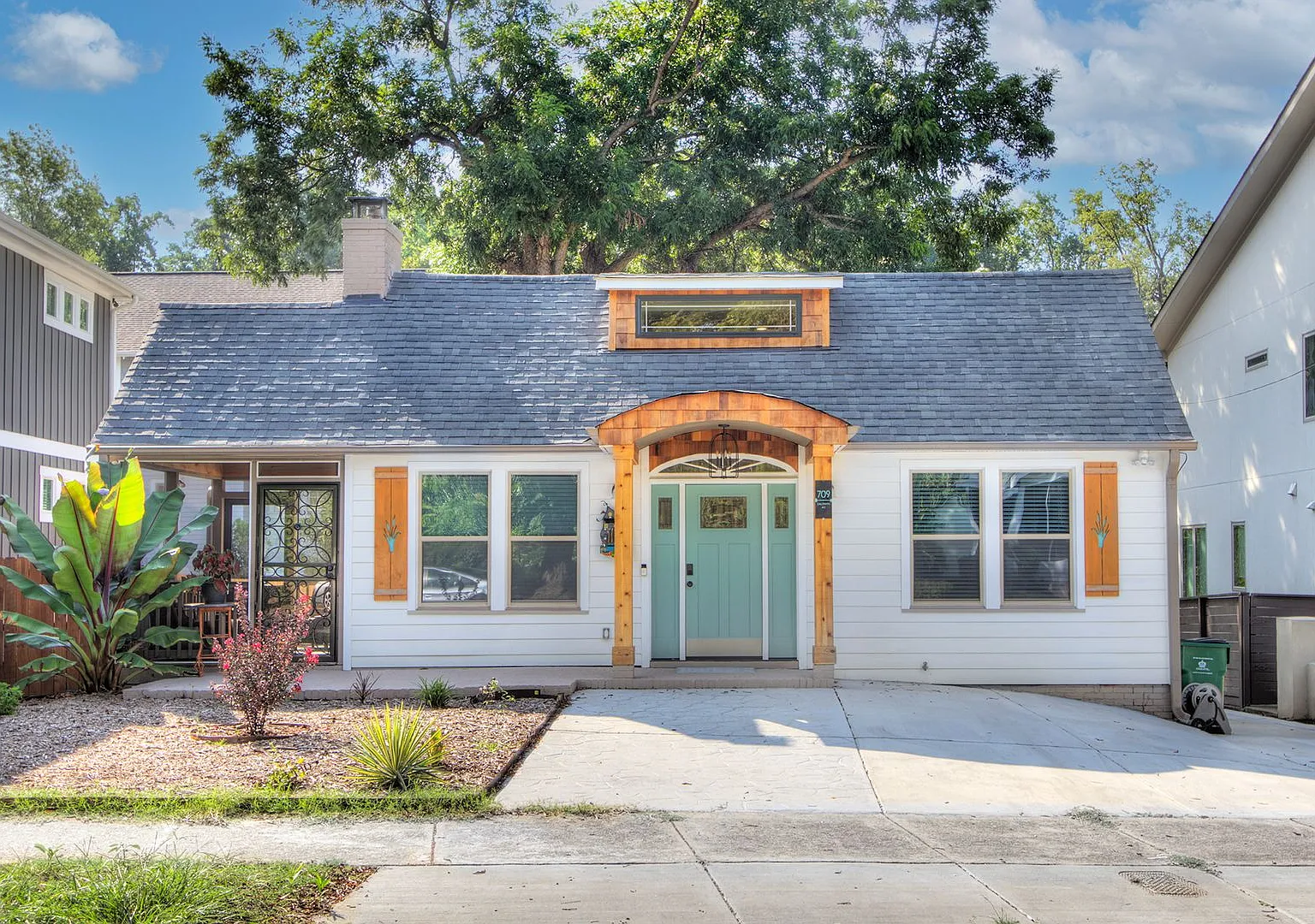 Discover the charm of this top-floor unit in a beautifully updated single-family bungalow — Photo 1