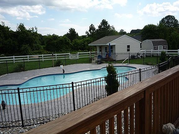 Custom inground pool with out building