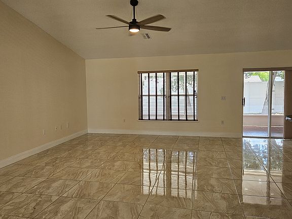 Family Room with Sliding Glass Door to the Back Patio