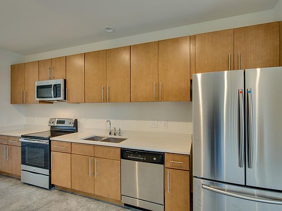 New stainless steel appliances, quartz countertops.