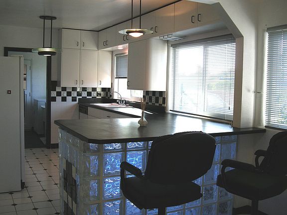 Beautiful black & white tile with glass block island.