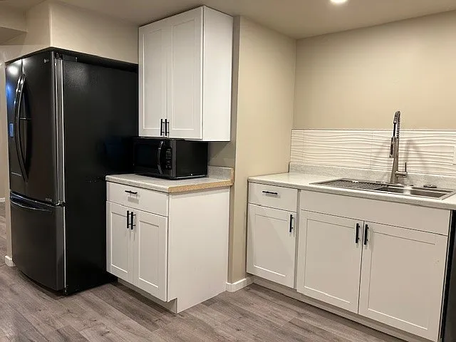Sink, matching microwave and French-door refrigerator.