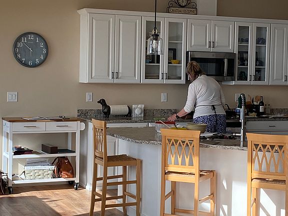 The spacious and convenient fully stocked kitchen, with counter seating.
for four.