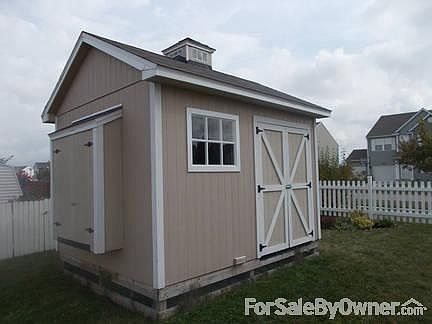 A spacious shed
						:
						A large storage shed with a bump for gardening/landscape tools.