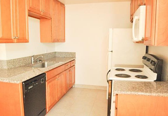 Upgraded kitchen includes marble countertops, dishwasher, sink-erator, etc.