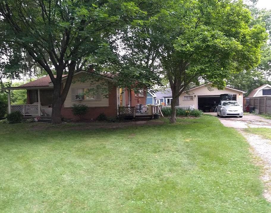 Front of house. Covered porch. Large yard. Lawn mowing included in rent