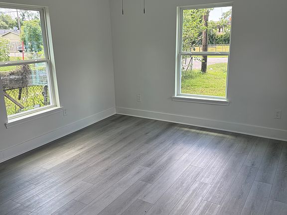 large bedroom 2, ceiling fan, natural light, windows, double rod closet