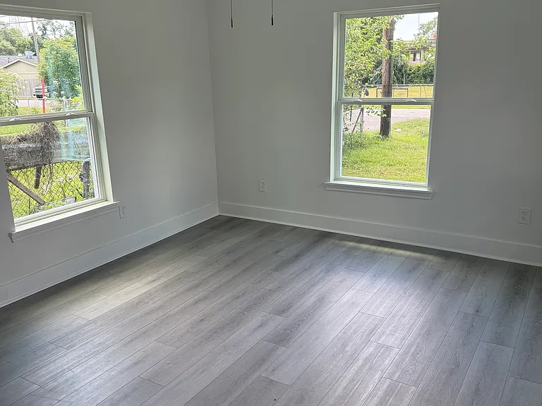 large bedroom 2, ceiling fan, natural light, windows, double rod closet