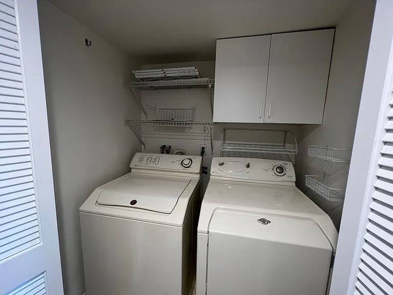 Washer dryer in unit.