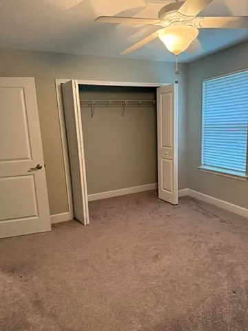 Upstairs bedroom # 2- front of house window views, blinds and ceiling fans included