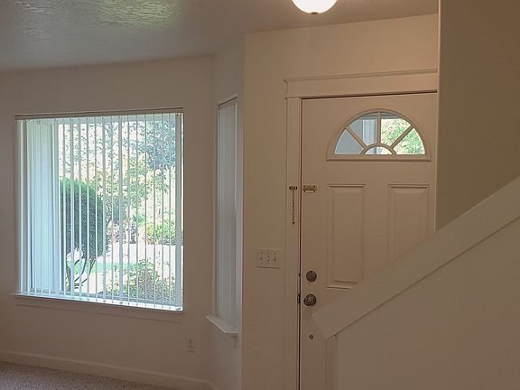Entry door, stairs to upper level