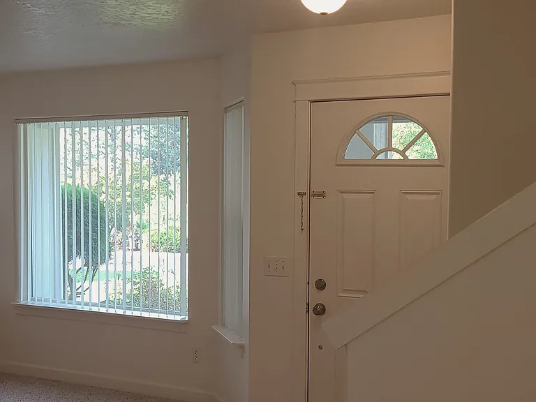 Entry door, stairs to upper level