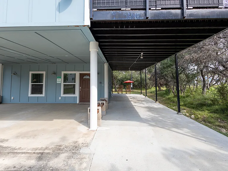 View of lower unit and covered parking area