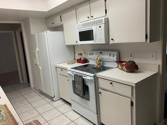 Large frig with water and ice thru the door, built-in microwave