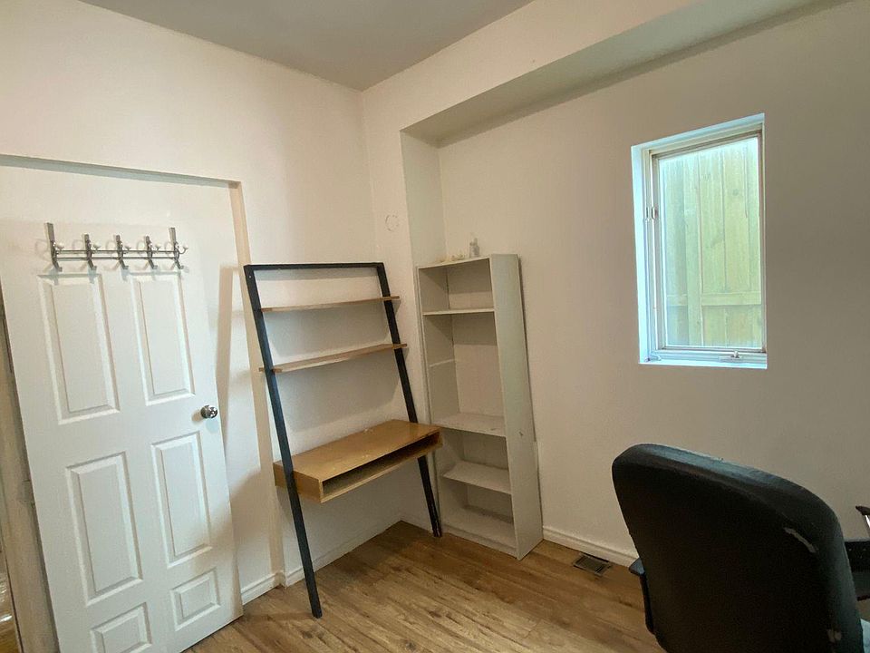 bedroom #3, new paint, computer chair,bookshelf, computer desk with storage area, wood floor, big windows