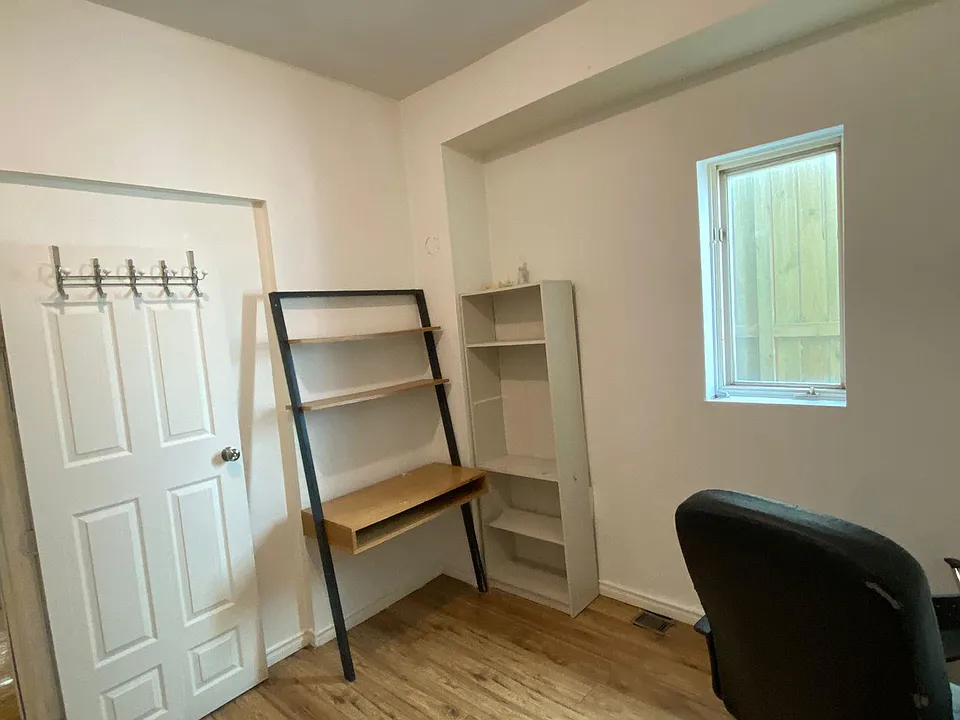 bedroom #3, new paint, computer chair,bookshelf, computer desk with storage area, wood floor, big windows