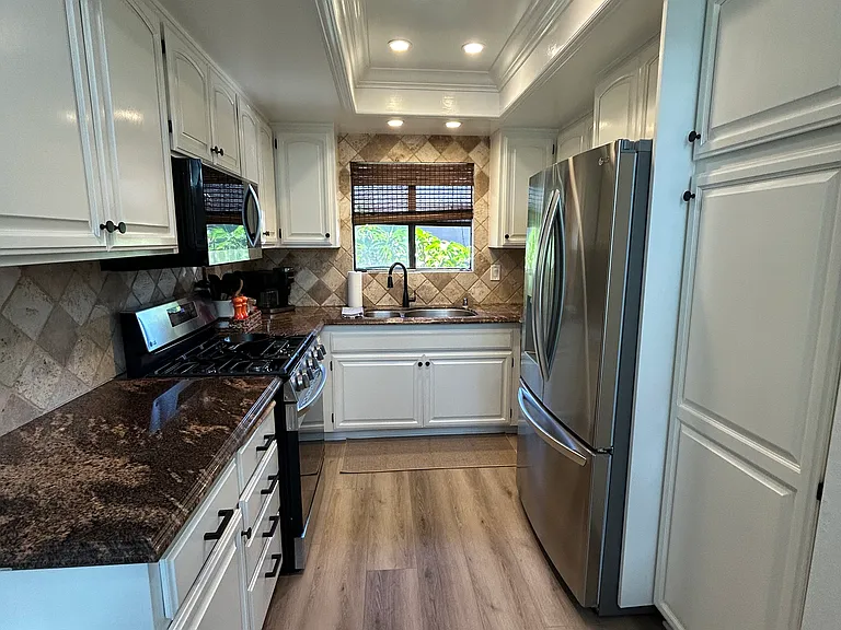 Functional kitchen with lots of storage. New appliances: Oven, Microwave, Dishwasher (refrigerator not included)
