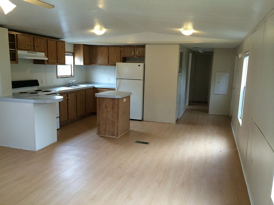 Large open kitchen and living room. This picture faces the kitchen.