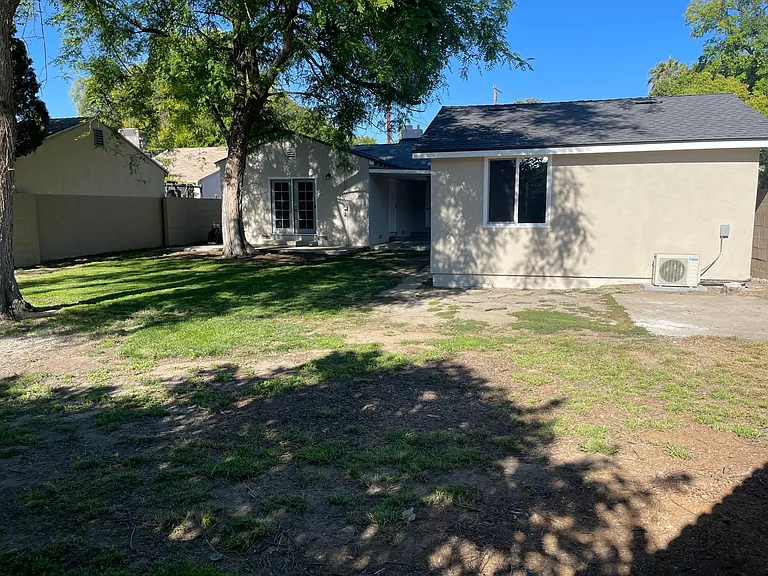 Large backyard with two patio areas. Great for pets and entertaining.

Detached garage with door access, lots of natural light and Air Conditioning.