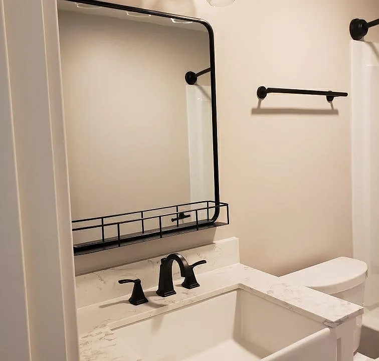 New, clean, functional bathroom with full size bath tub and shower.