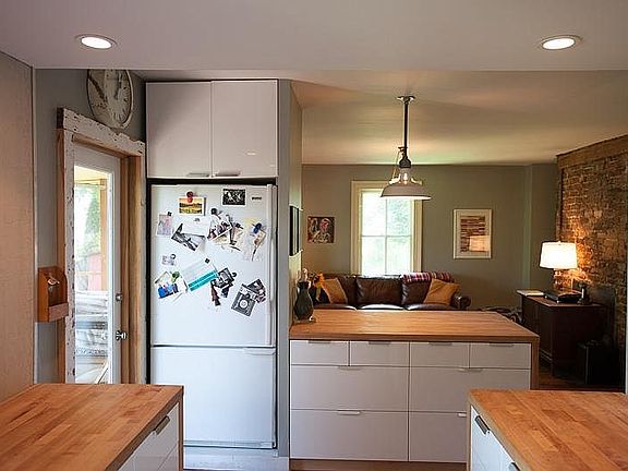 Additional view of the kitchen with nested refrigerator, add