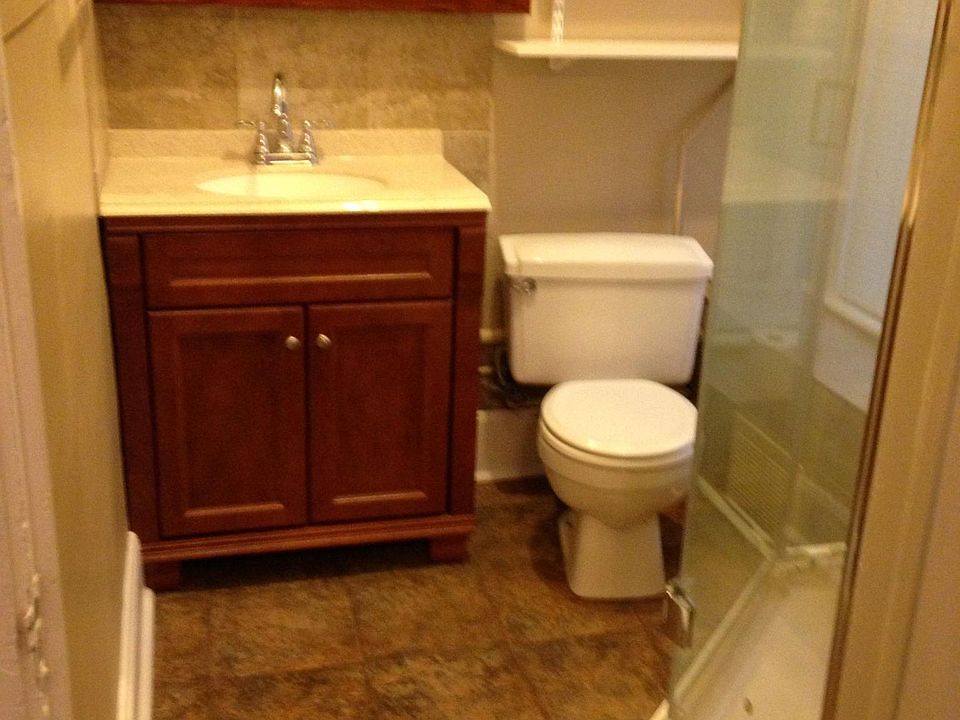 Bathroom has towels and shower