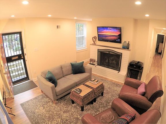 Sun filled living room with gas fireplace