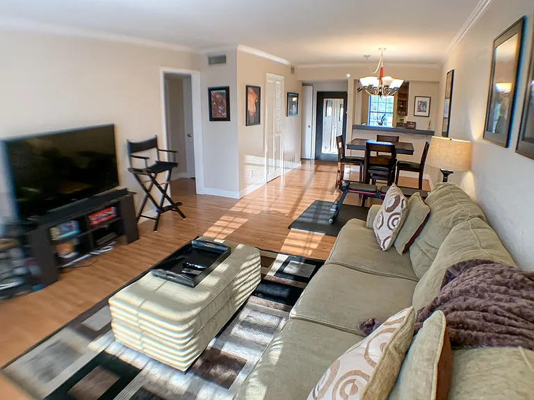 Beautiful living room with open floor design and hardwood floors.