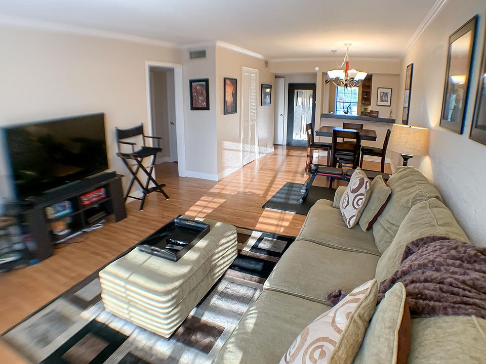 Beautiful living room with open floor design and hardwood floors.