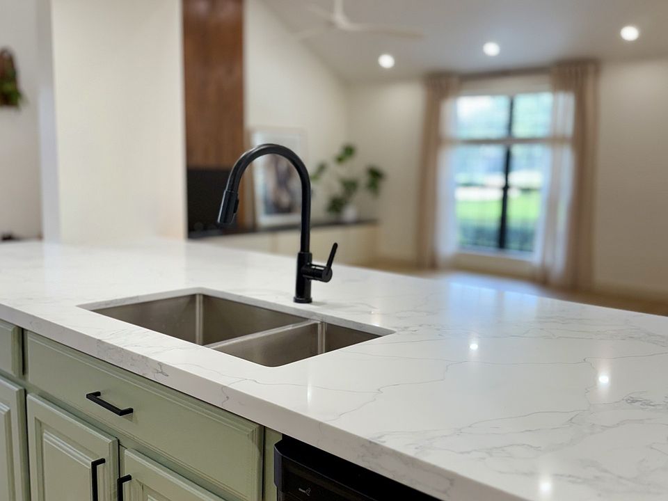 New Quartz counter which can seat 4 people comfortably, with underbench microwave and Maytag dishwasher.