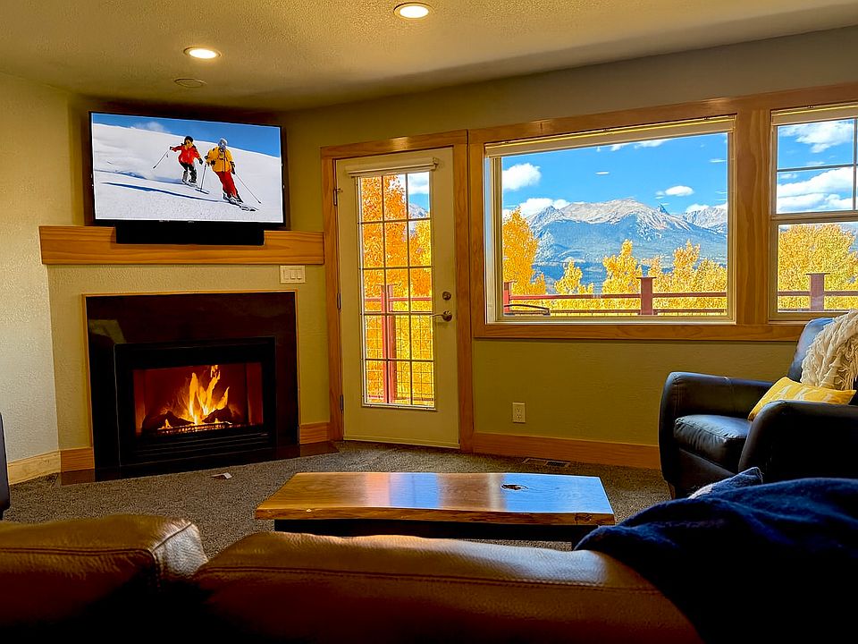 Enjoy the view: a crackling fire, vivid fall leaves, and snow-capped mountains_all from your living room.