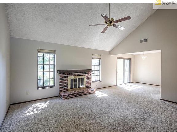 Family room view.  Patio doors lead out to sunroom.  To the right by patio doors is the kitchen