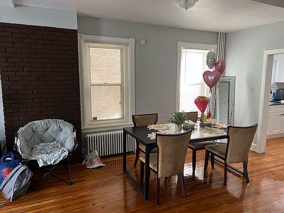 Dining Area with Exposed Brick Wall