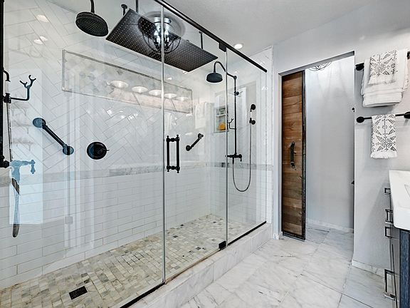 Two shower taps plus rainfall shower.