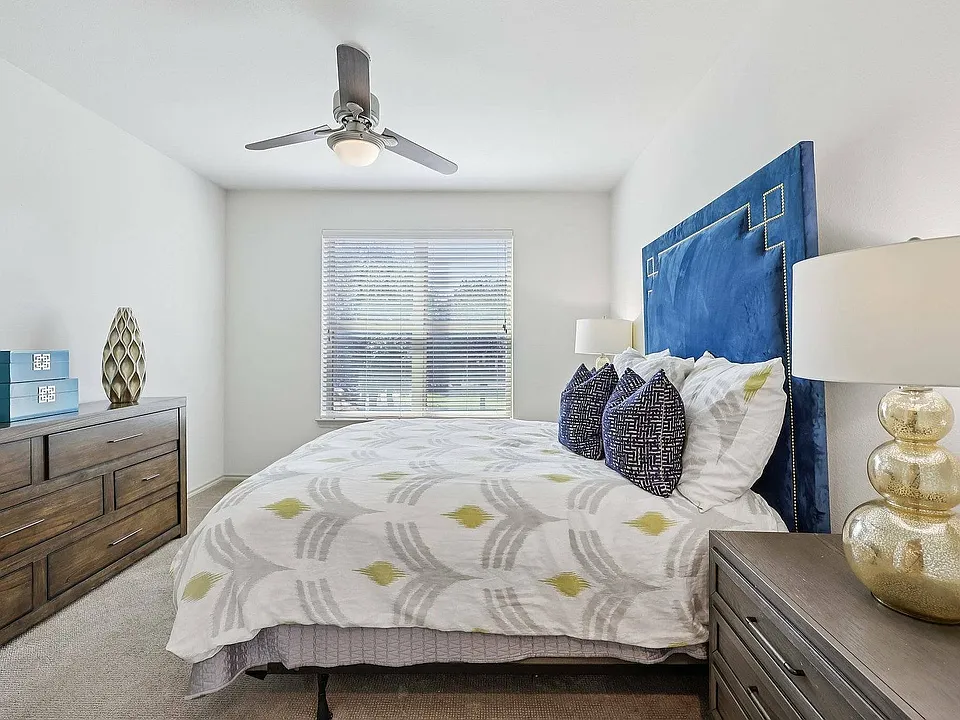 Relax in the comfort of your modern bedroom at McDermott 55 in Plano.