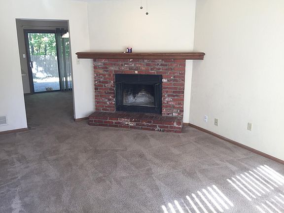 Main Entry Living Room Wood Burning Fireplace (See other photo with New Flooring)