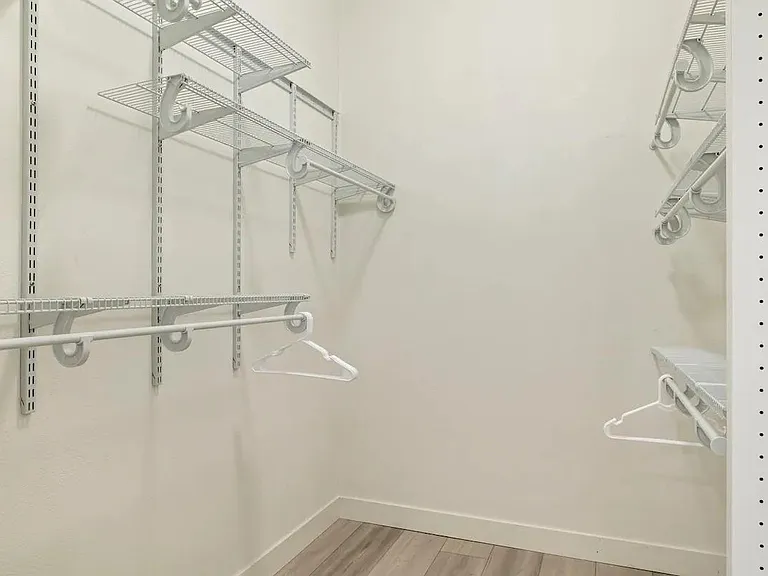 Walk in closet in primary bedroom