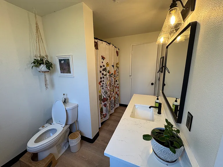 Upstairs bathroom with tub