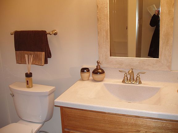 New bath with tile floor and shower. 