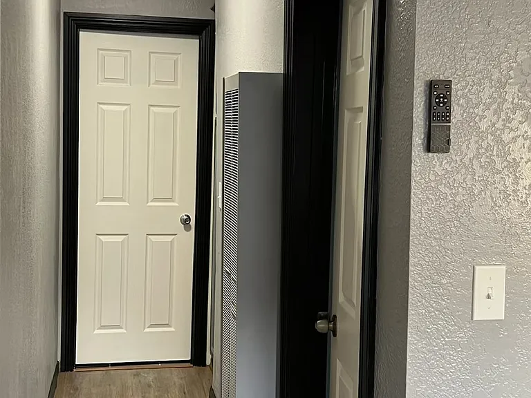 Bathroom at the end of the hallway. Bedroom entrance on the right side.